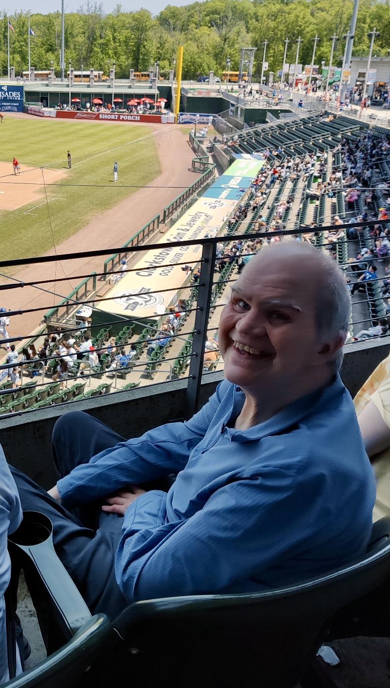 Client attends a baseball game